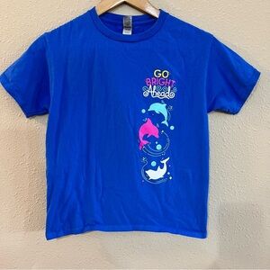Girl Scout Blue Kids Shirt with Dolphin Print with plushie and cup.